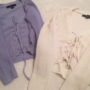 Two knit lace up sweaters